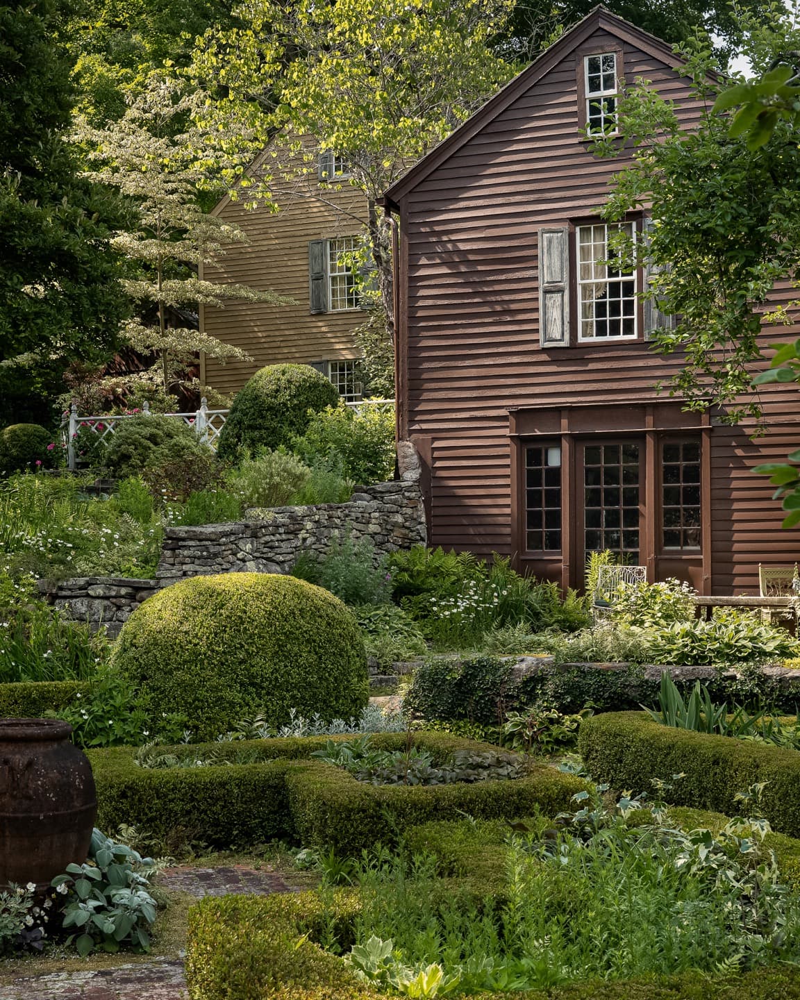 Historic buildings surrounded by a landscaped Connecticut garden